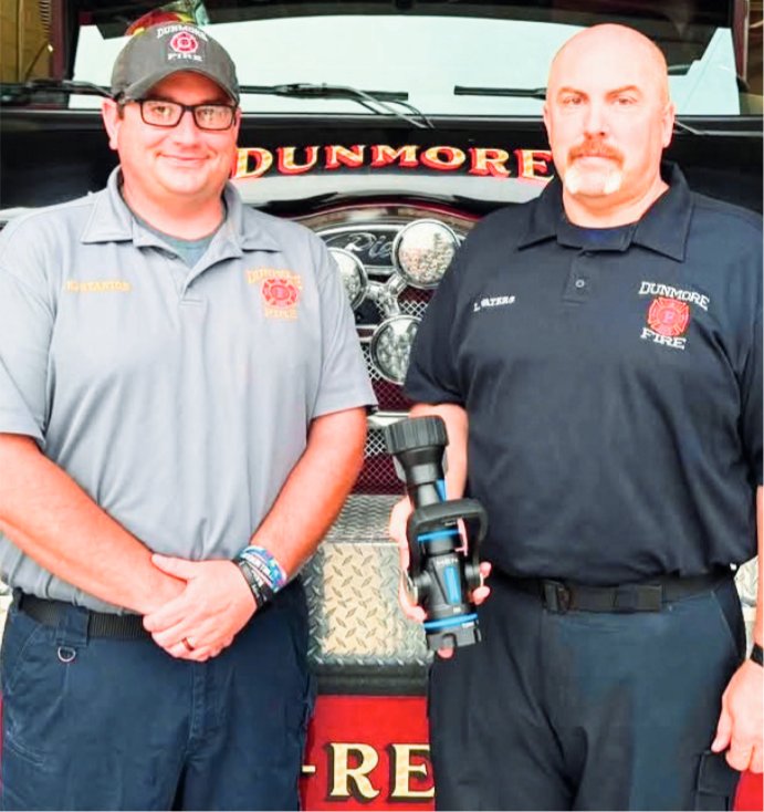 Lt. Kyle Stanton and Larry Waters display a blade force nozzle which was provided to the Dunmore Fire Department through a grant from the Dunmore Lions Club.